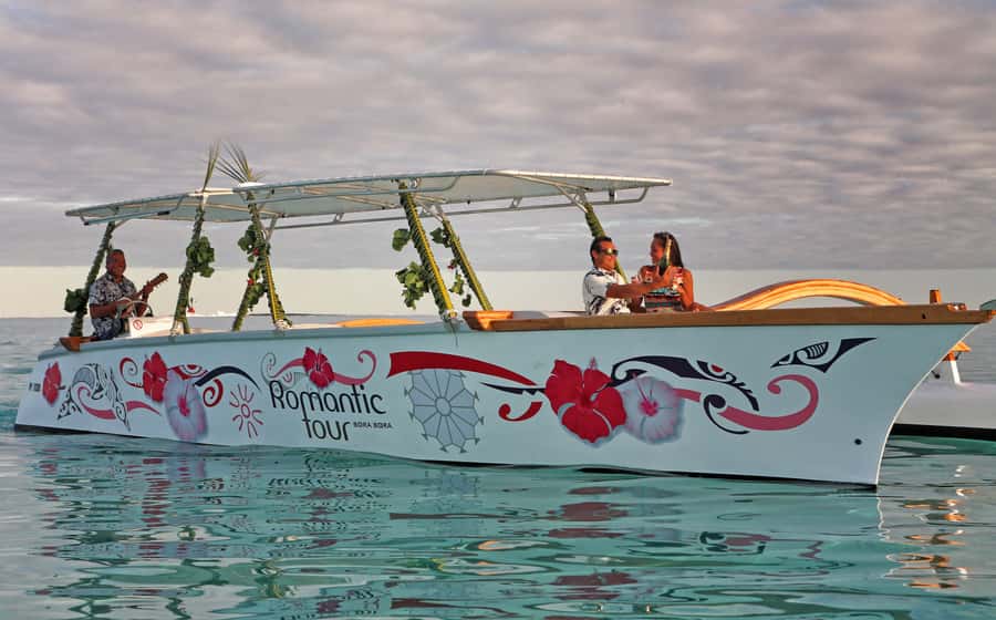 Bora Bora: Combo Sunset Cruise & Romantic Dinner at St James - Boarding a Polynesian outrigger canoe