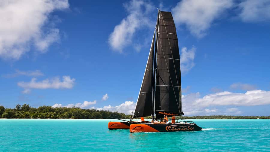 Bora Bora: Sunset Catamaran Cruise with Snacks and Drinks - Setting out from your hotel dock