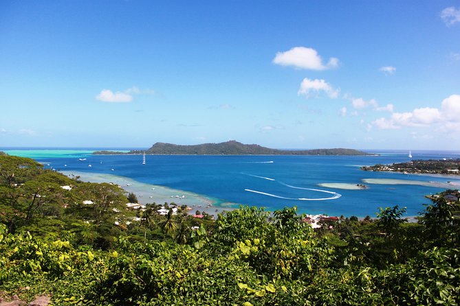 Island Tour & Getaway on the Bora Bora Mountains by Quad / ATV - A family snack stop with fruit and coconut bread